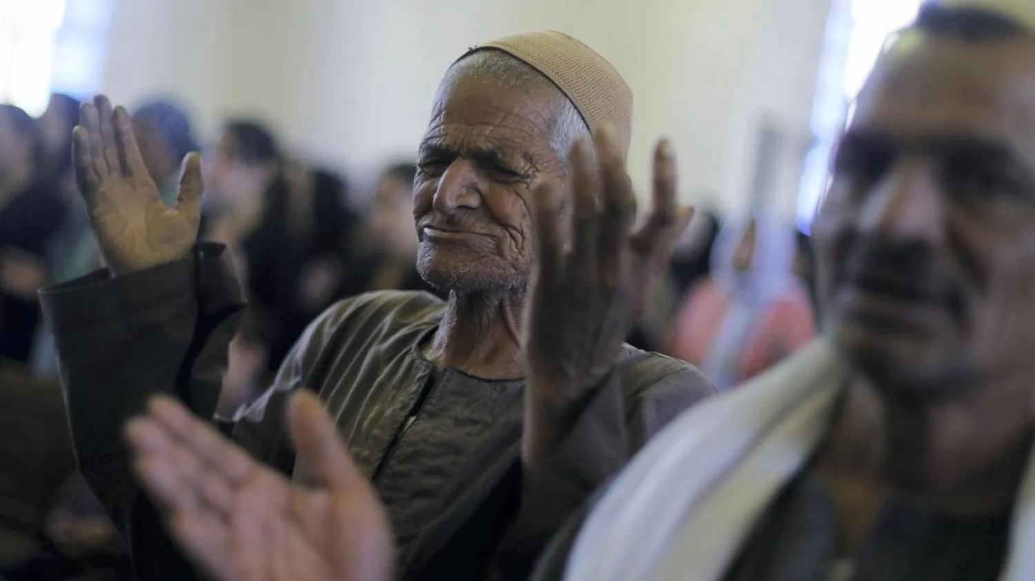 Coptic Egyptians pray during a funeral ceremony for the remains of the bodies of 20 Egyptian Christians beheaded in Libya by ISIS in 2015. (Reuters)