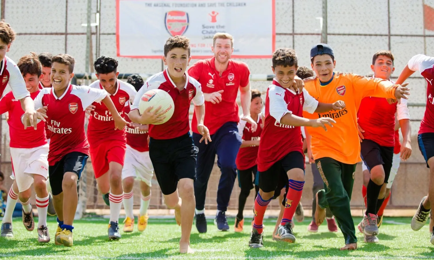 Per Mertesacker launches Save the Children’s coaching program with youngsters at Zaatari refugee camp in the north of Jordan, near the border with Syria. Photograph: Save the Children/AP