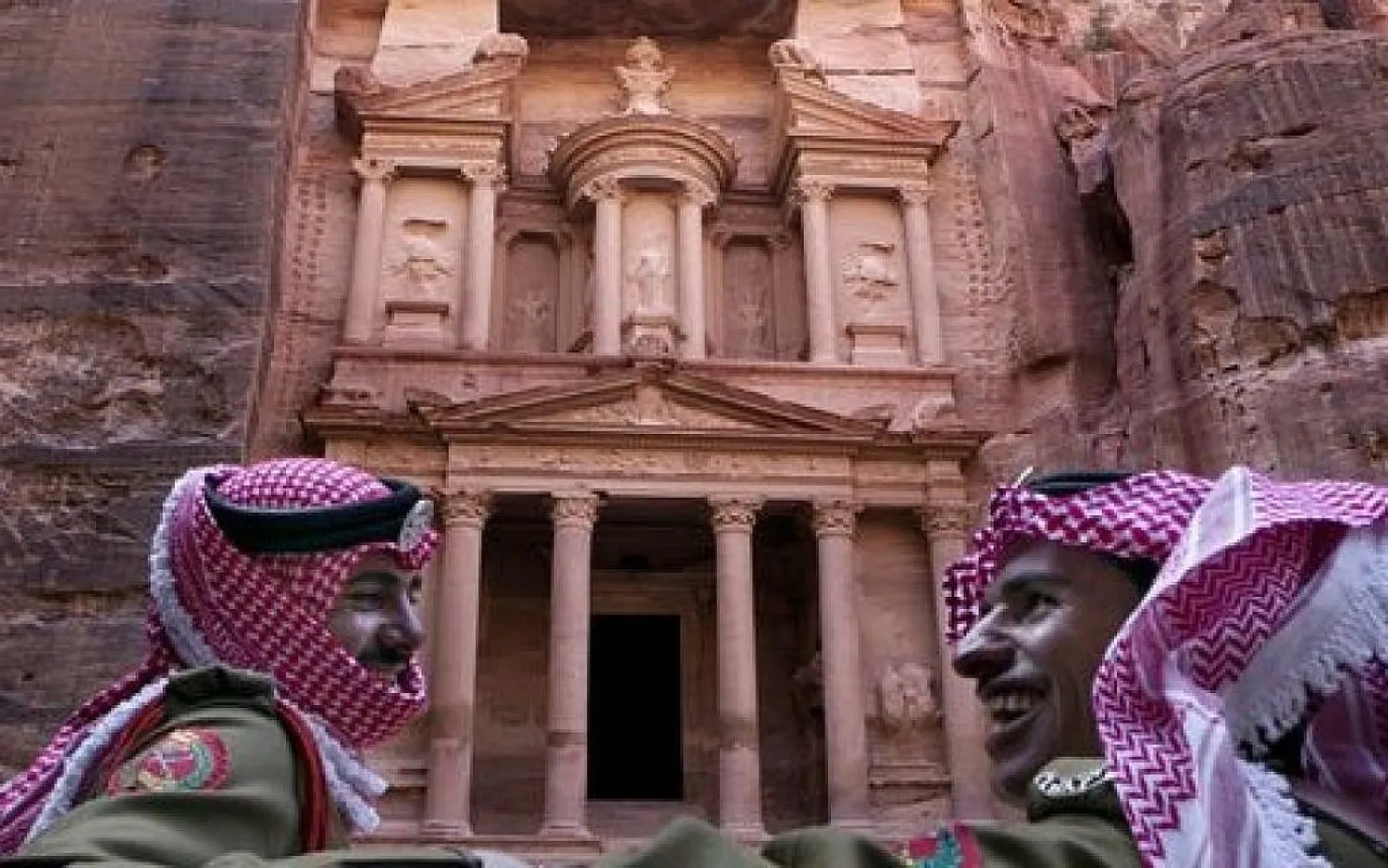 Jordanian royal desert forces stand guard in front of Al Khazneh, Arabic for the Treasury, the most dramatic of many facades carved into the mountains, in the ancient city of Petra, Jordan. March 24, 2015 (photo credit: AP/Raad Adayleh)
