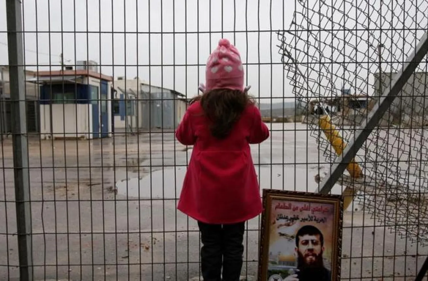 A Palestinian girl stands outside an Israeli jail. (AFP/File Photo)