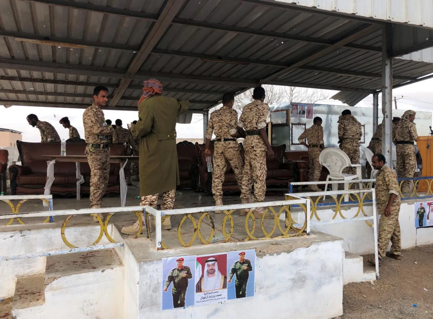 Soldiers inspect the scene of a Houthi drone attack at Yemeni government military parade in al-Anad air base, Lahj province, Yemen January 10, 2019. (Reuters)