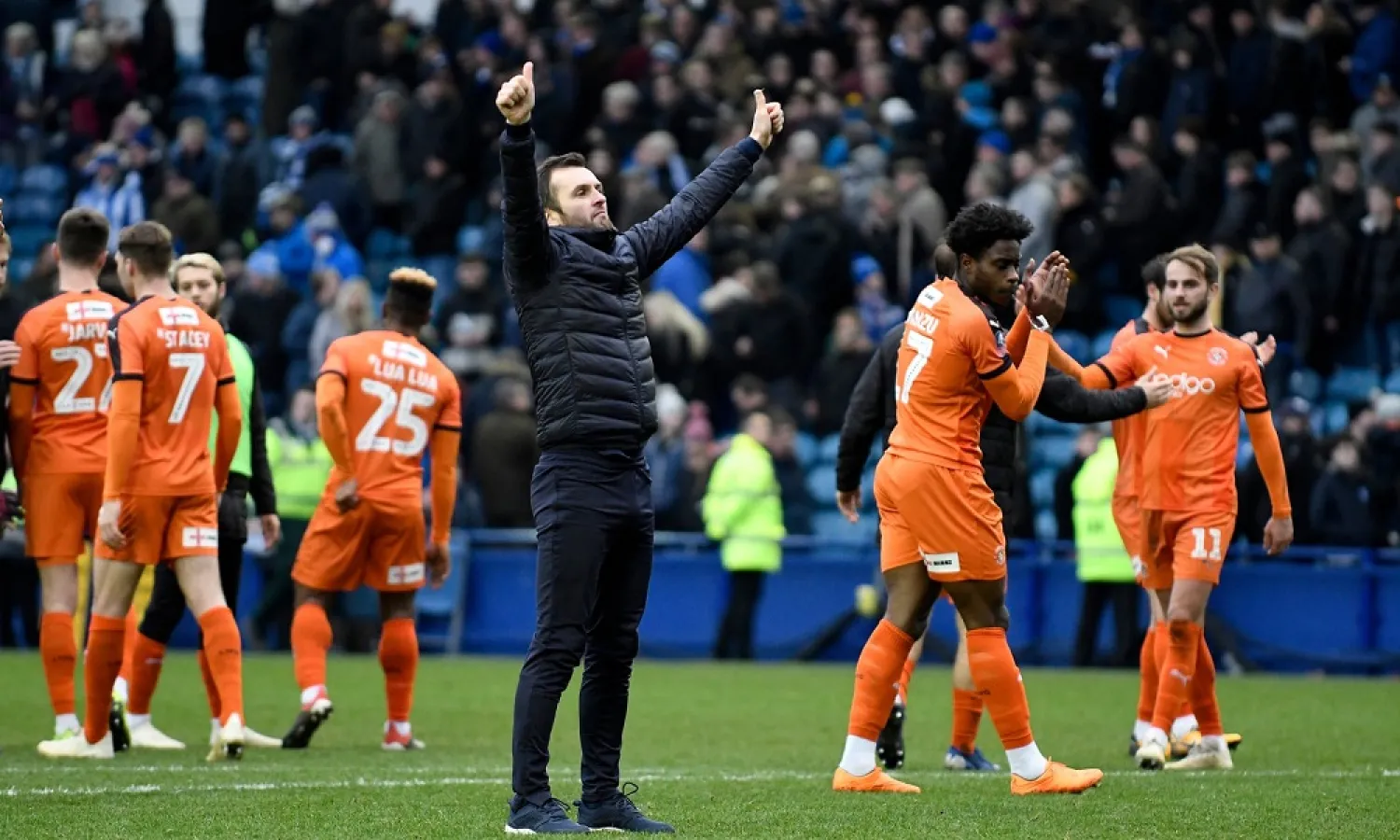 Nathan Jones salutes the traveling Luton fans. (Getty Images)