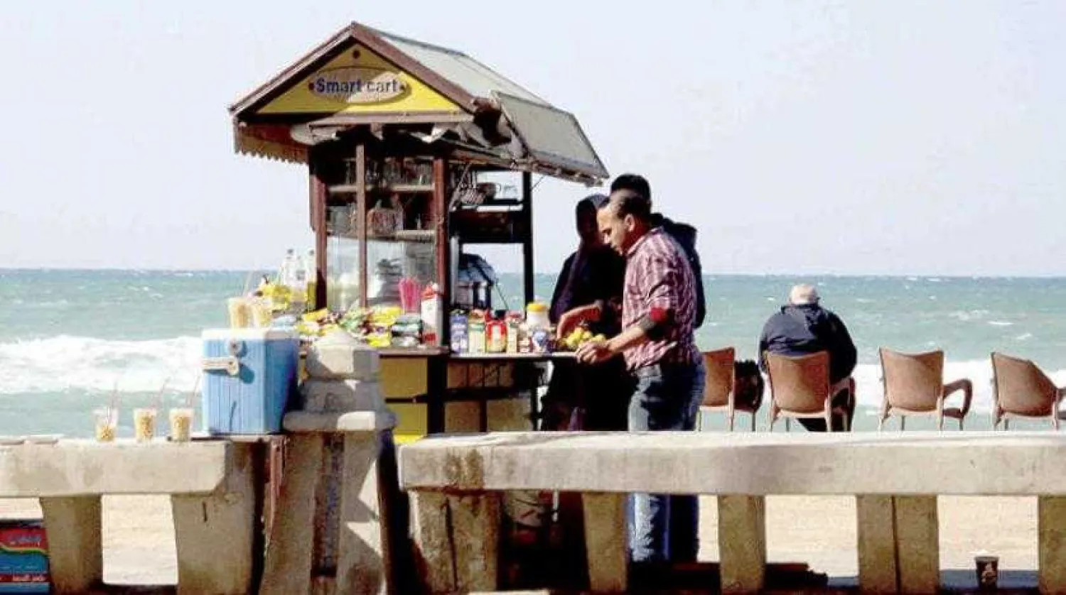 Street food vendor working at Alexandria’s promenade corniche, Asharq Al-Awsat
