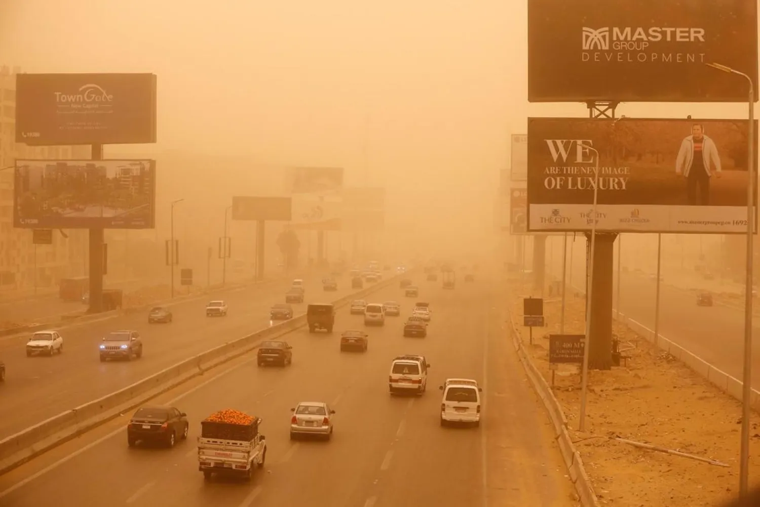 Vehicles drive during a sandstorm in Cairo, Egypt, Wednesday, Jan. 16, 2019. (AP Photo/Amr Nabil)
