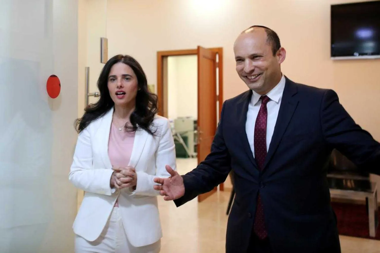 Israeli Education Minister Naftali Bennett (R) and Justice Minister Ayelet Shaked, from the Jewish Home party, enter the room before delivering their statements in Tel Aviv. December 29, 2018. REUTERS/Corinna Kern