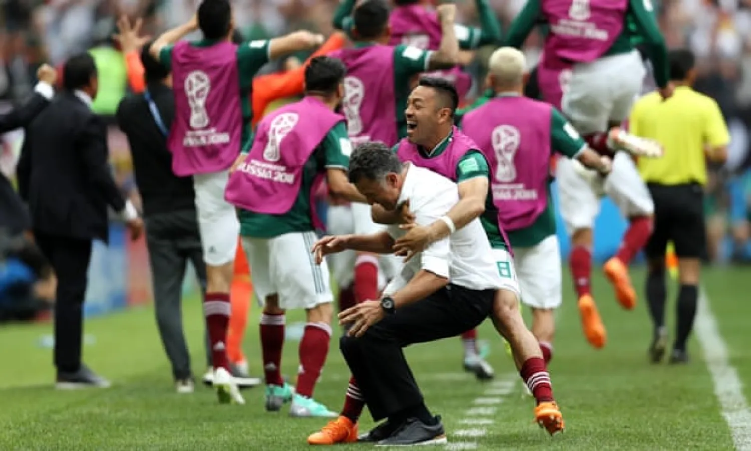  Juan Carlos Osorio (centre) lived within sight of Liverpool’s Melwood training ground for two years. Last year his Mexico team reached the last 16 of the World Cup. Photograph: Clive Rose/Getty Images
