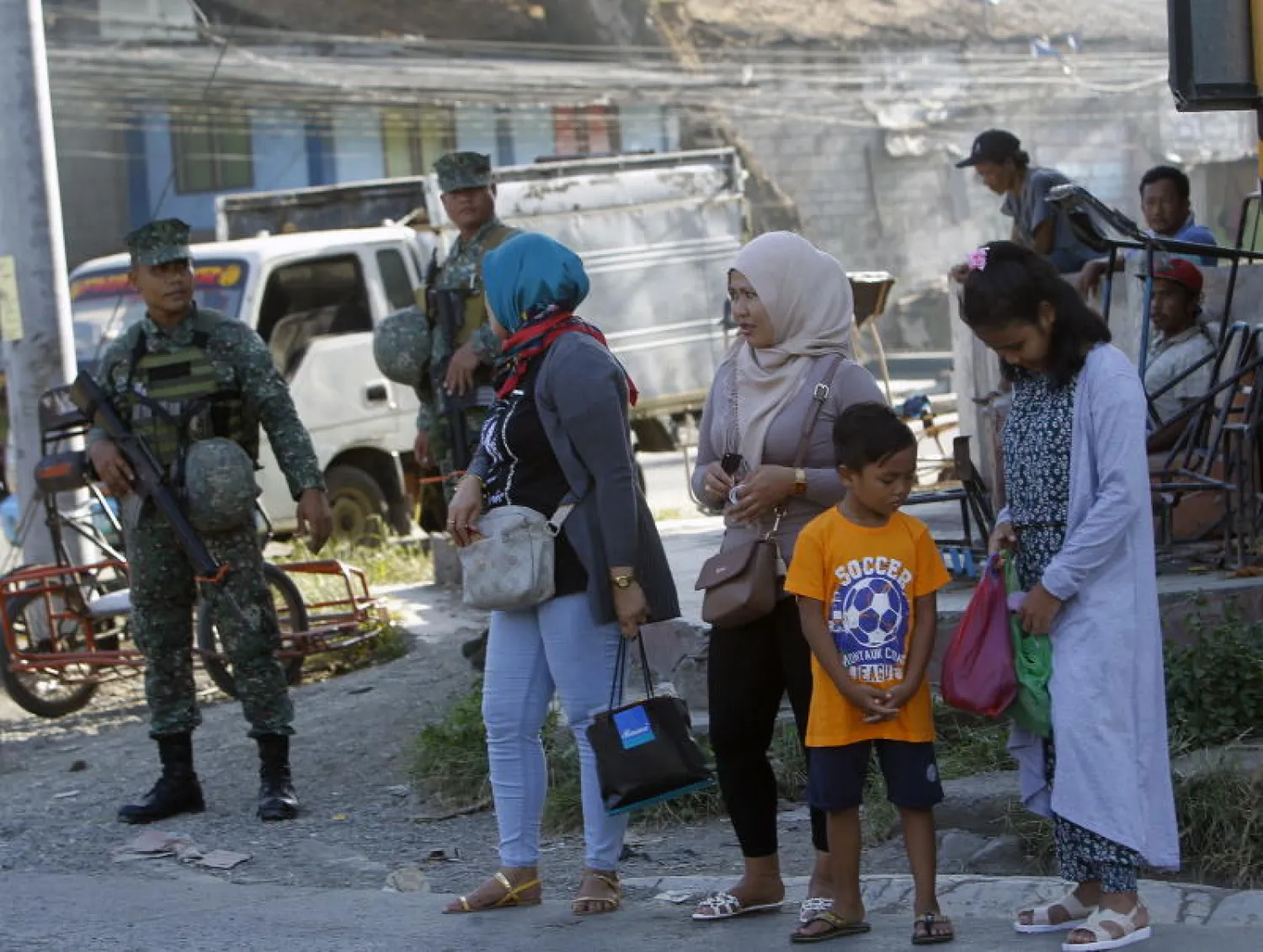 Filipino soldiers stand guard at a Muslim community in Zamboanga city, Southern Philippines, on July 26, 2018. PHOTO: EPA-EFE