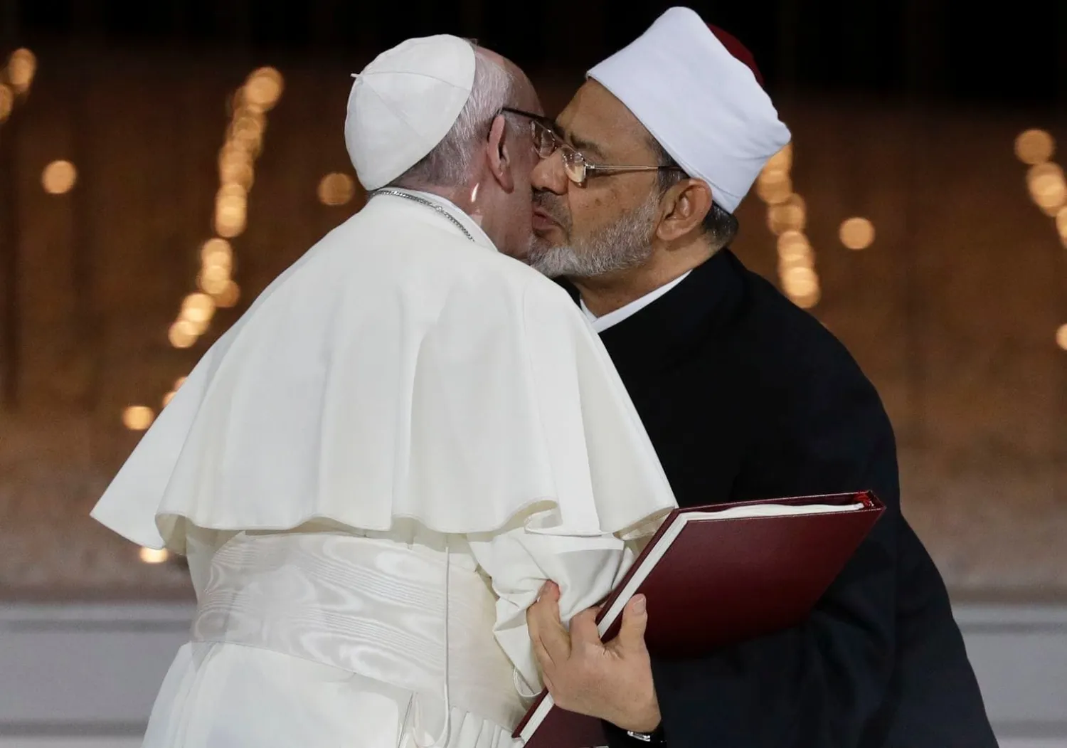 Pope Francis hugs Sheikh Ahmed el-Tayeb, the grand imam of Egypt's Al-Azhar, after an Interreligious meeting at the Founder's Memorial in Abu Dhabi, United Arab Emirates, Monday, Feb. 4, 2019. (AP Photo/Andrew Medichini)