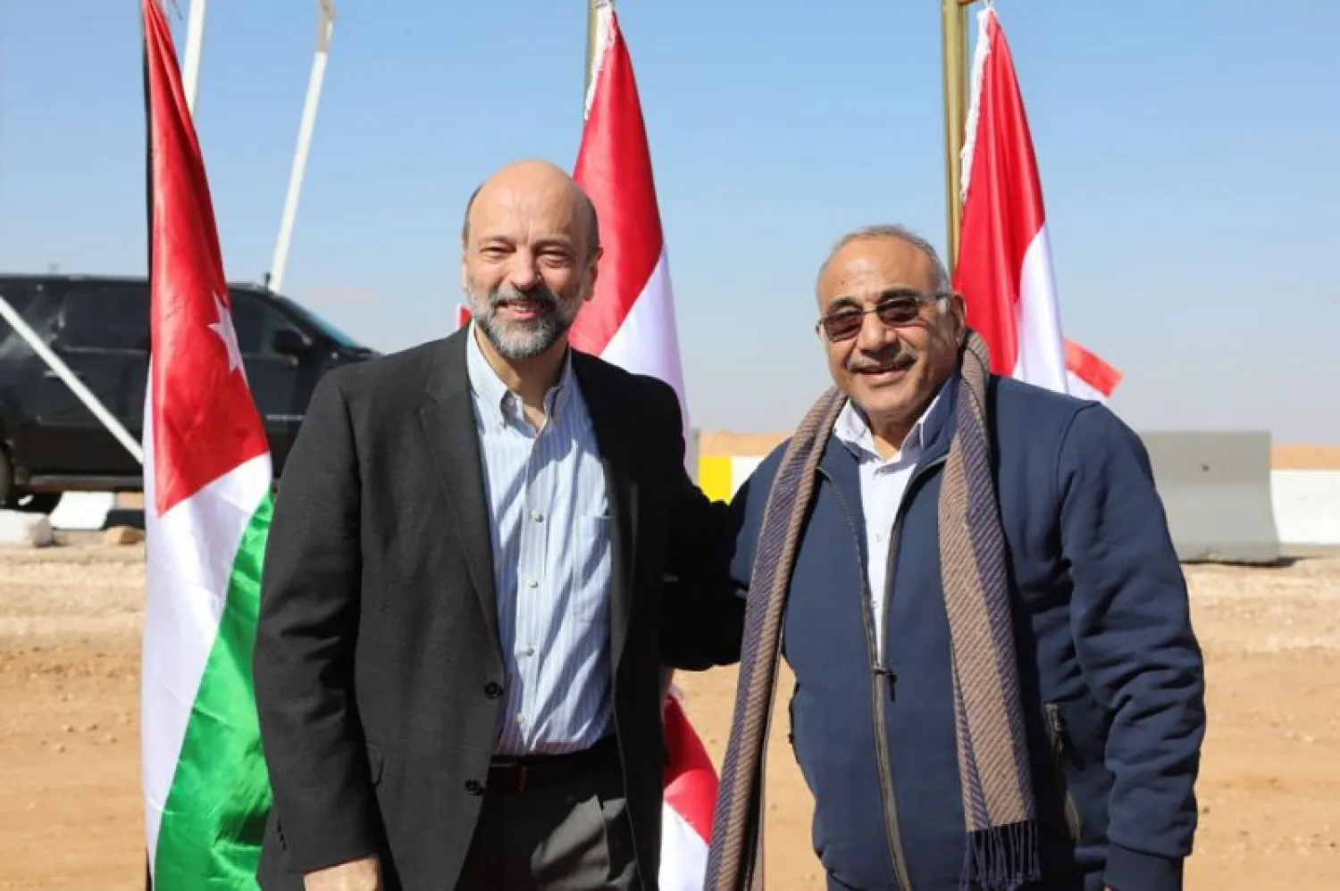 Iraqi Prime Minister Adel Abdul Mahdi, right, and his Jordanian counterpart Omar al-Razzaz meet at border. (AFP)