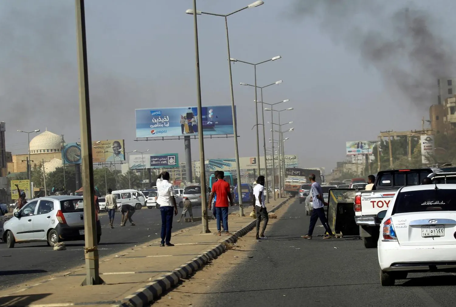 Cars block a road as Sudanese demonstrators stage an anti-government protests in Khartoum, Sudan January 25, 2019. (Reuters)

