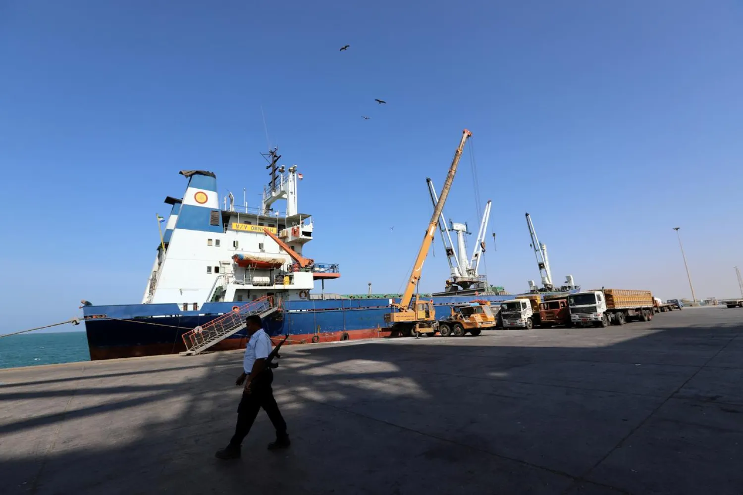 FILE PHOTO: A coast guard walks past a ship docked at the Red Sea port of Hodeidah, Yemen January 5, 2019. REUTERS/Abduljabbar Zeyad/File Photo