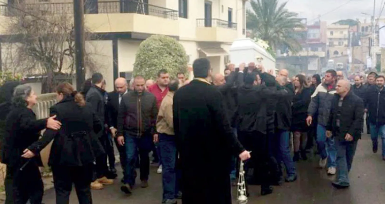 من تشييع جورج زريق في بلدته شمال لبنان أمس (الوكالة الوطنية للإعلام)