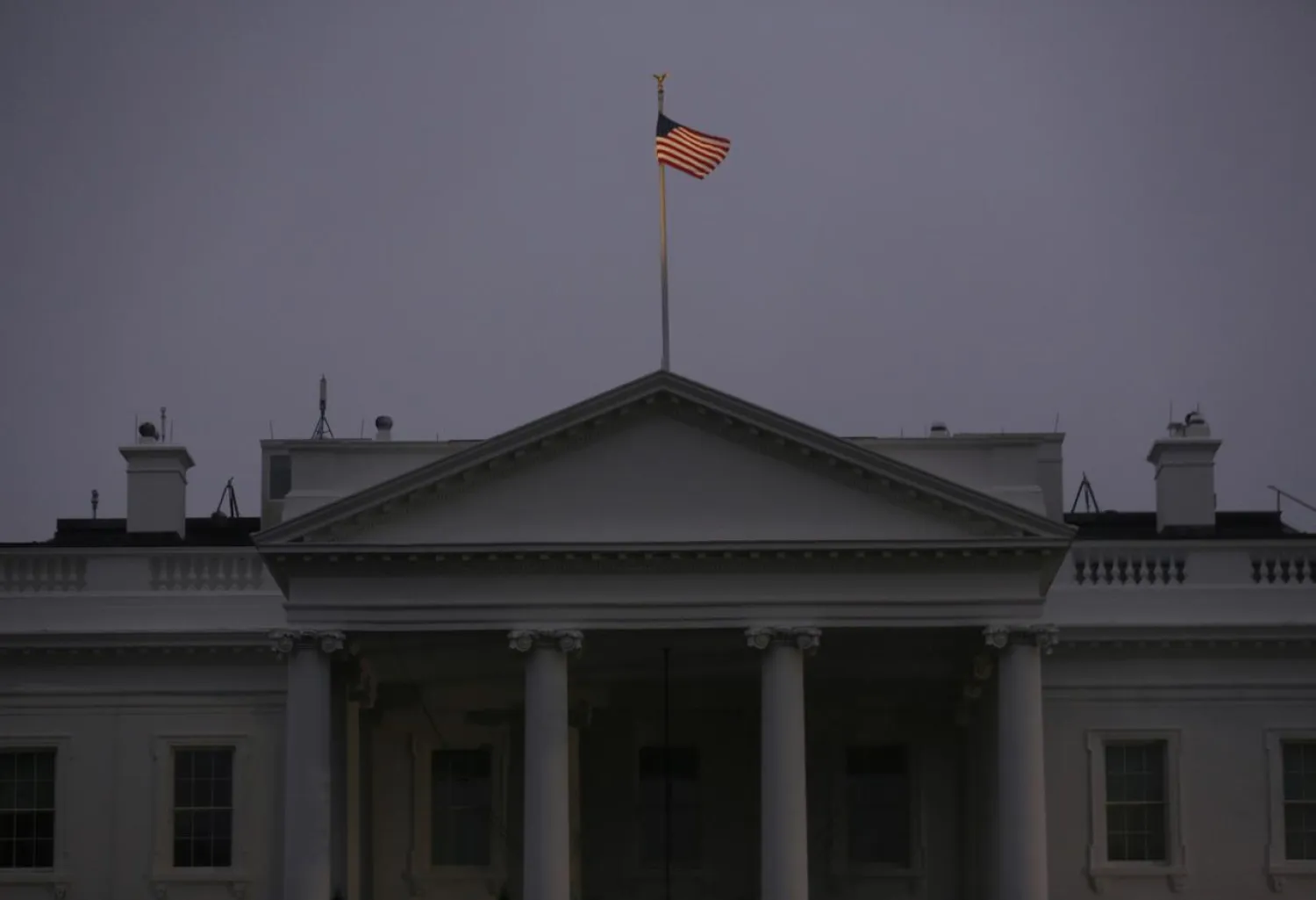 The US flag flies in a dawn breeze on top of the White House in Washington, US, November 6, 2018. Reuters