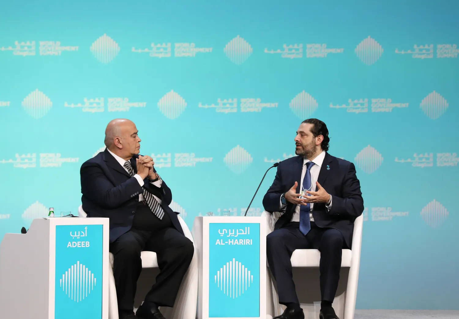 Lebanese Prime Minister Saad Hariri (R), speaks with journalist Emad el-Din Adeeb, during the opening session of the World Government Summit in Dubai, on February 10, 2019. Dalati and Nohra photo