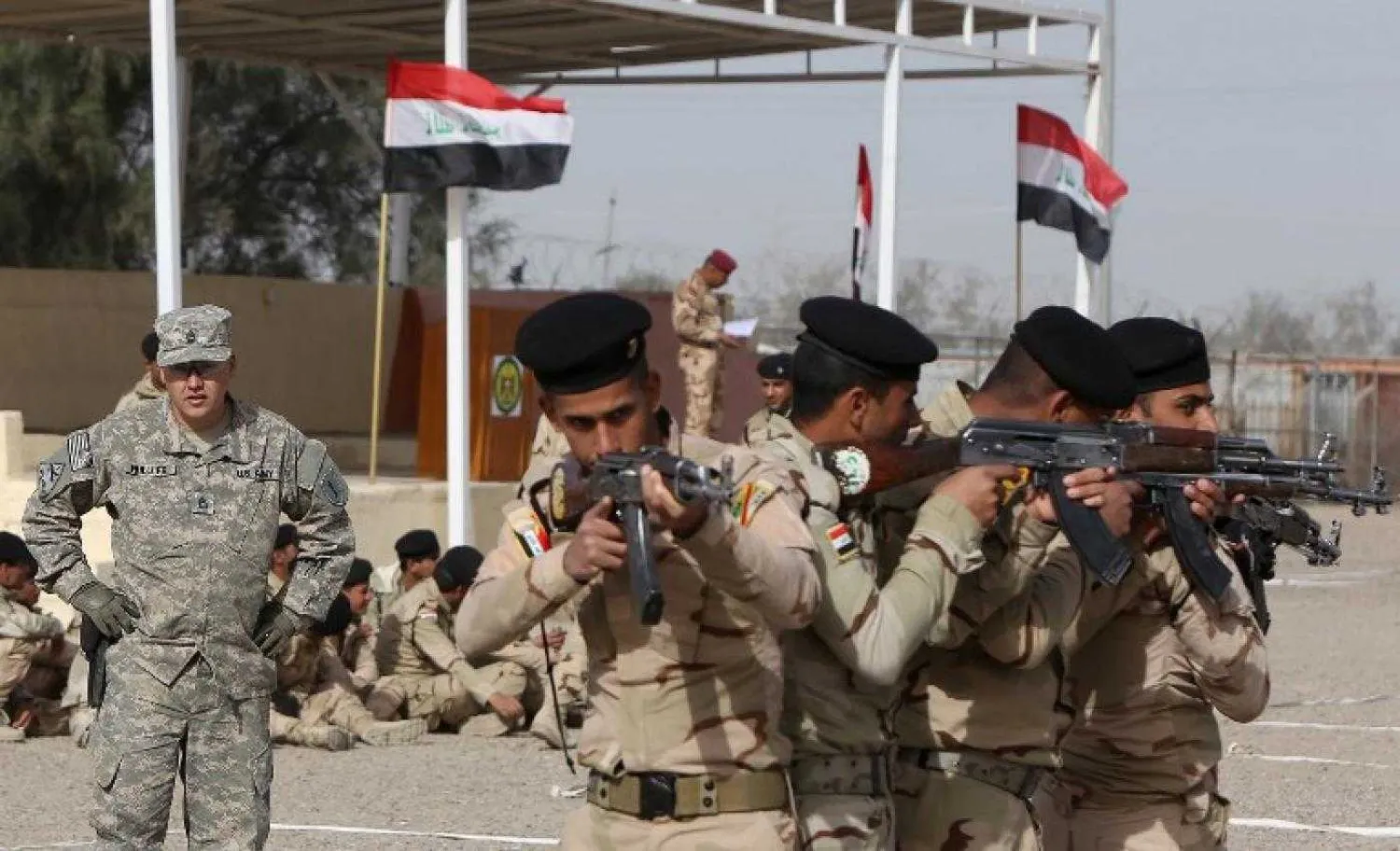 US military trainers show Iraqi soldiers how to work in a formation near Baghdad in 2015 (AFP)
