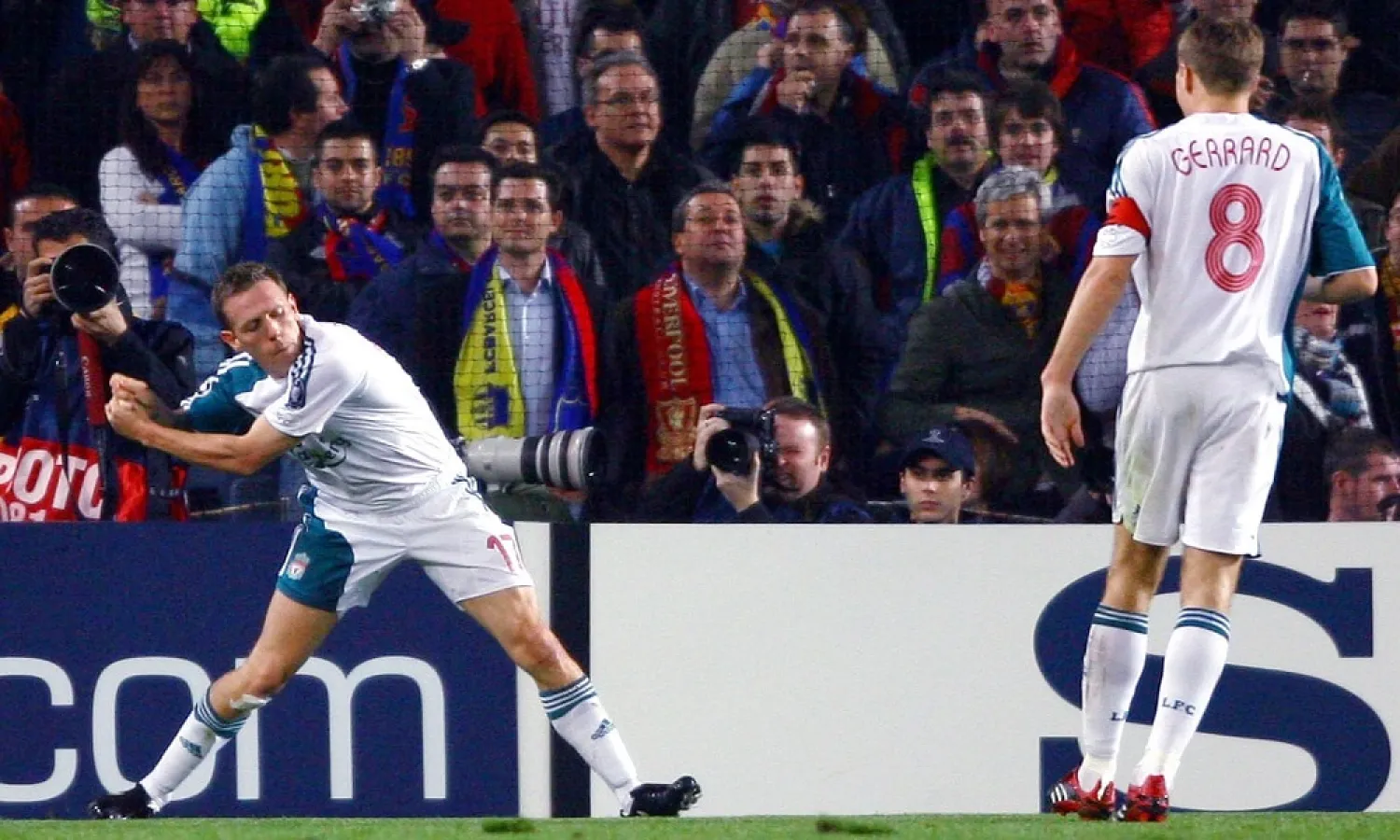 Craig Bellamy celebrates scoring for Liverpool against Barcelona by swinging an imaginary golf club in reference to his clash with teammate John Arne Riise in the Algarve. (Getty Images)
