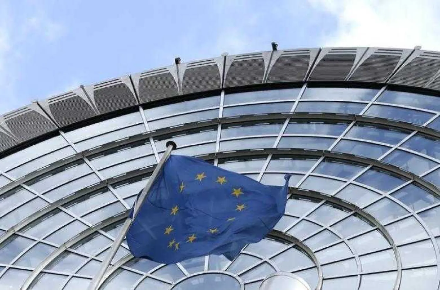 An European Union flag flutters outside of the European Parliament in Brussels October 12, 2012. REUTERS/Francois Lenoir