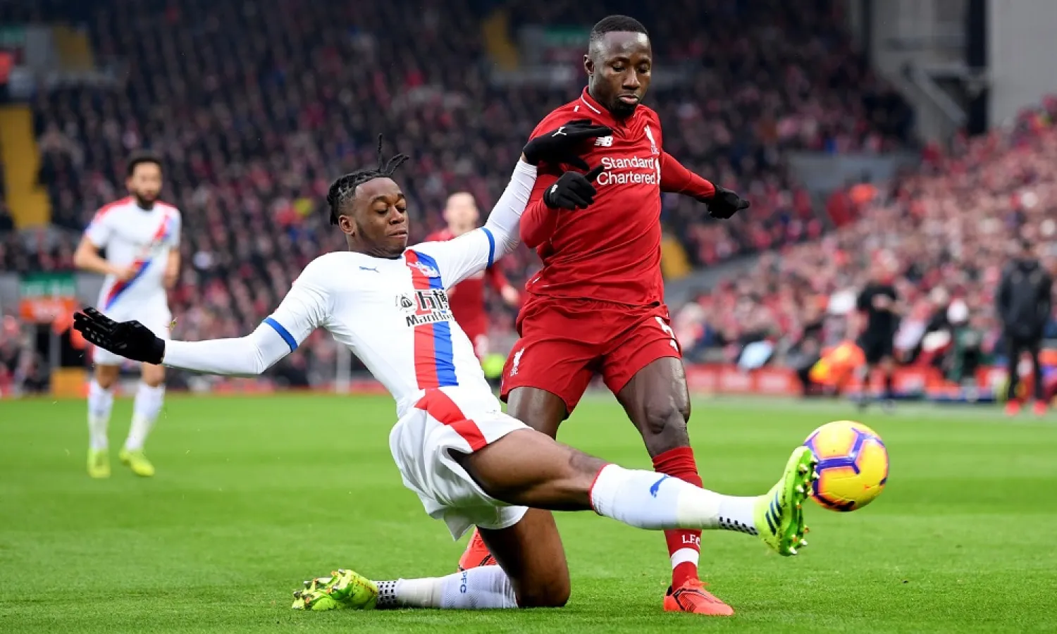 Aaron Wan-Bissaka dispossesses Liverpool’s Naby Keita at Anfield. (Getty Images)