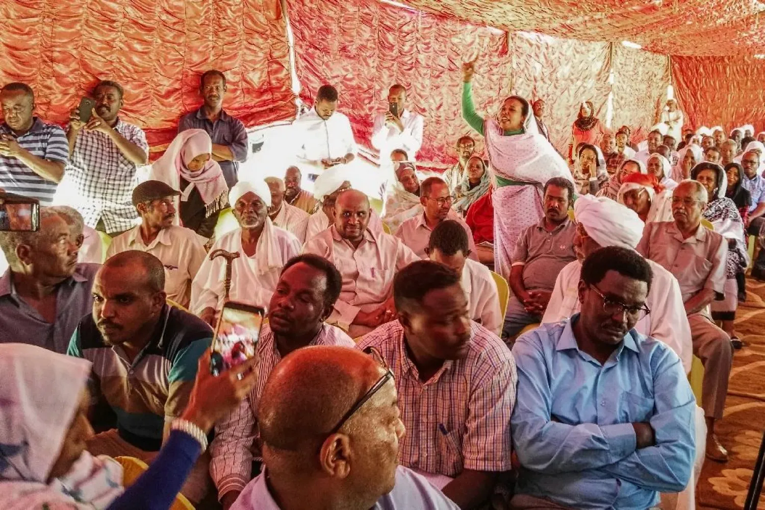 Supporters of Sudan's main opposition Umma Party attend a press conference in the capital Khartoum's twin city of Omdurman on February 13, 2019. (AFP)