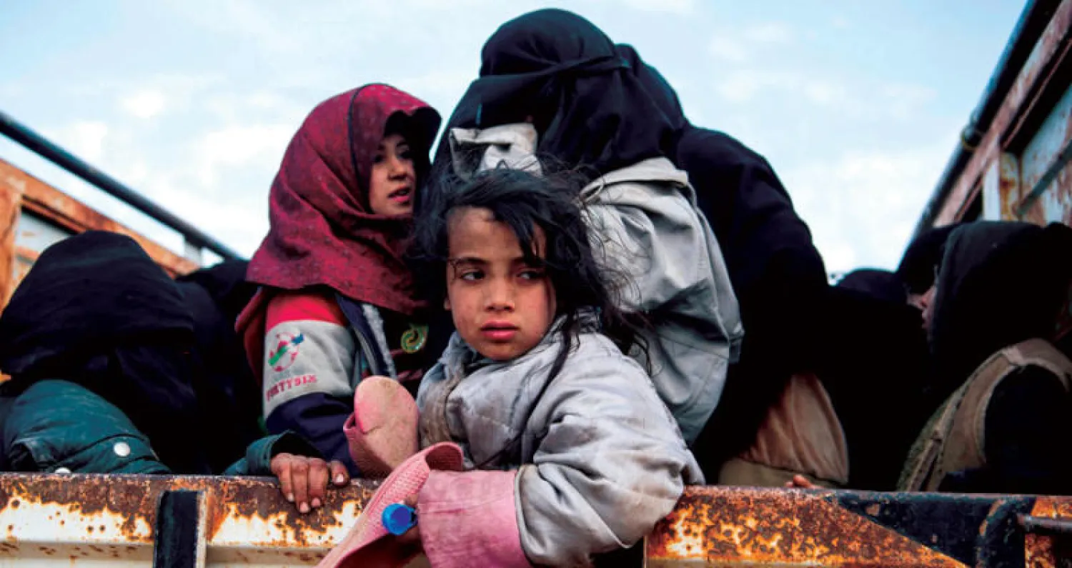 مدنيون نزحوا من الباغوز شرق سوريا (أ.ف.ب)