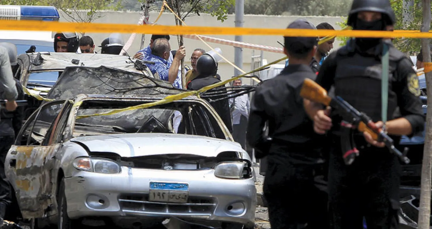 صورة أرشيفية لموقع تفجير موكب النائب العام المصري السابق هشام بركات في القاهرة في يونيو 2015  (رويترز)