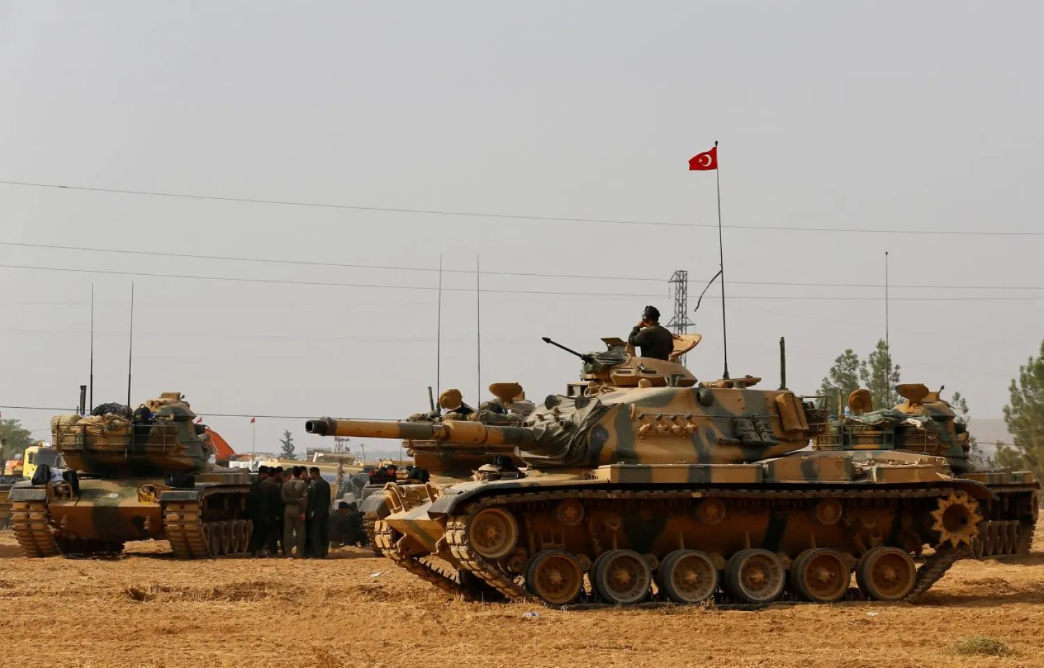 Turkish army tanks and military personal are stationed in Karkamis on the Turkish-Syrian border in the southeastern Gaziantep province, Turkey, August 25, 2016. REUTERS/Umit Bektas/File Photo