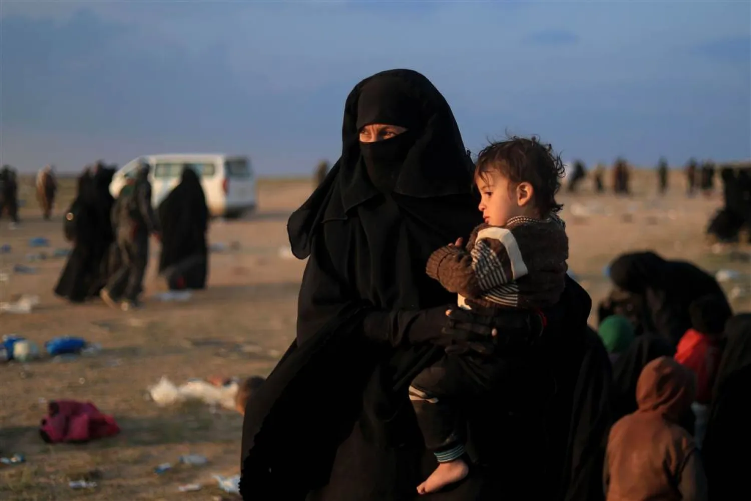 US-backed fighters on Friday trucked some 2,000 people out of the ISIS group's last scrap of territory in eastern Syria | AFP