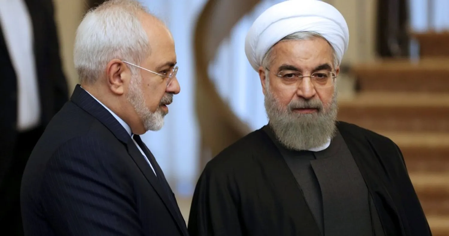 Iranian President Hassan Rouhani listens to his Foreign Minister Mohammad Javad Zarif prior to a meeting in Tehran, Iran, in November 2015. (AP)