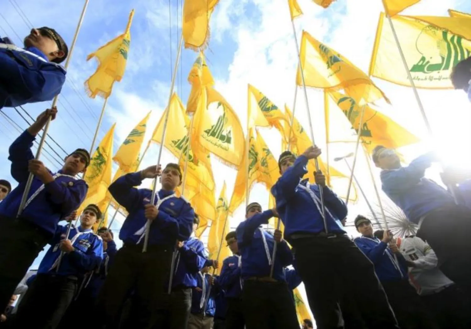 Hezbollah scouts carry their party's flags during a march. Reuters file photo