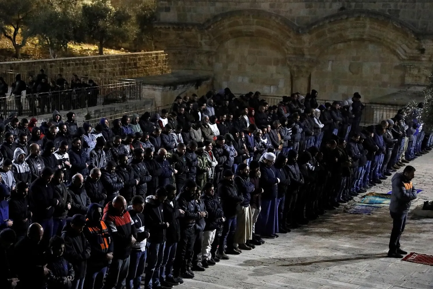 Palestinians pray near Bab al-Rahma in the al-Aqsa mosque compound in Jerusalem on February 20. (AFP)