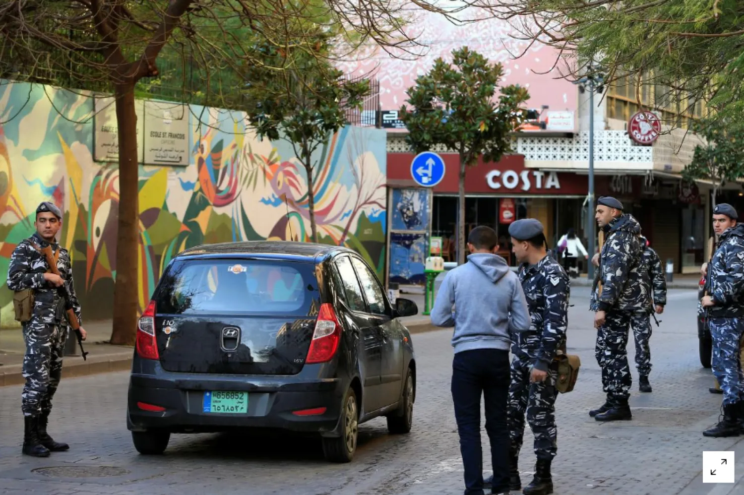 Police officers man a checkpoint near Costa coffee shop in Hamra street in Beirut, Lebanon January 22, 2017. REUTERS/Jamal Saidi