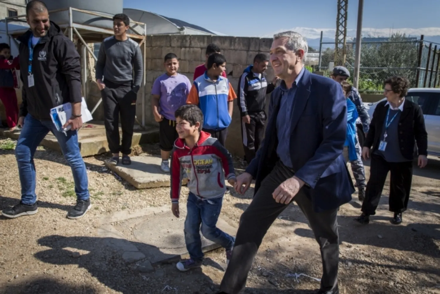 Eight-year-old Abdulhay, a refugee from Syria, welcomes UN High Commissioner for Refugees Filippo Grandi as he visits an informal refugee settlement in Mhammara, Lebanon.
© UNHCR/Andrew McConnell