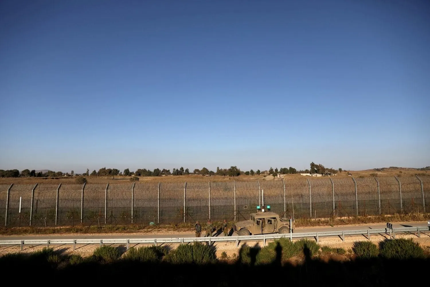 Israeli soldiers patrol the ceasefire line between Israel and Syria, as seen from the Israeli-occupied Golan Heights. (Reuters)