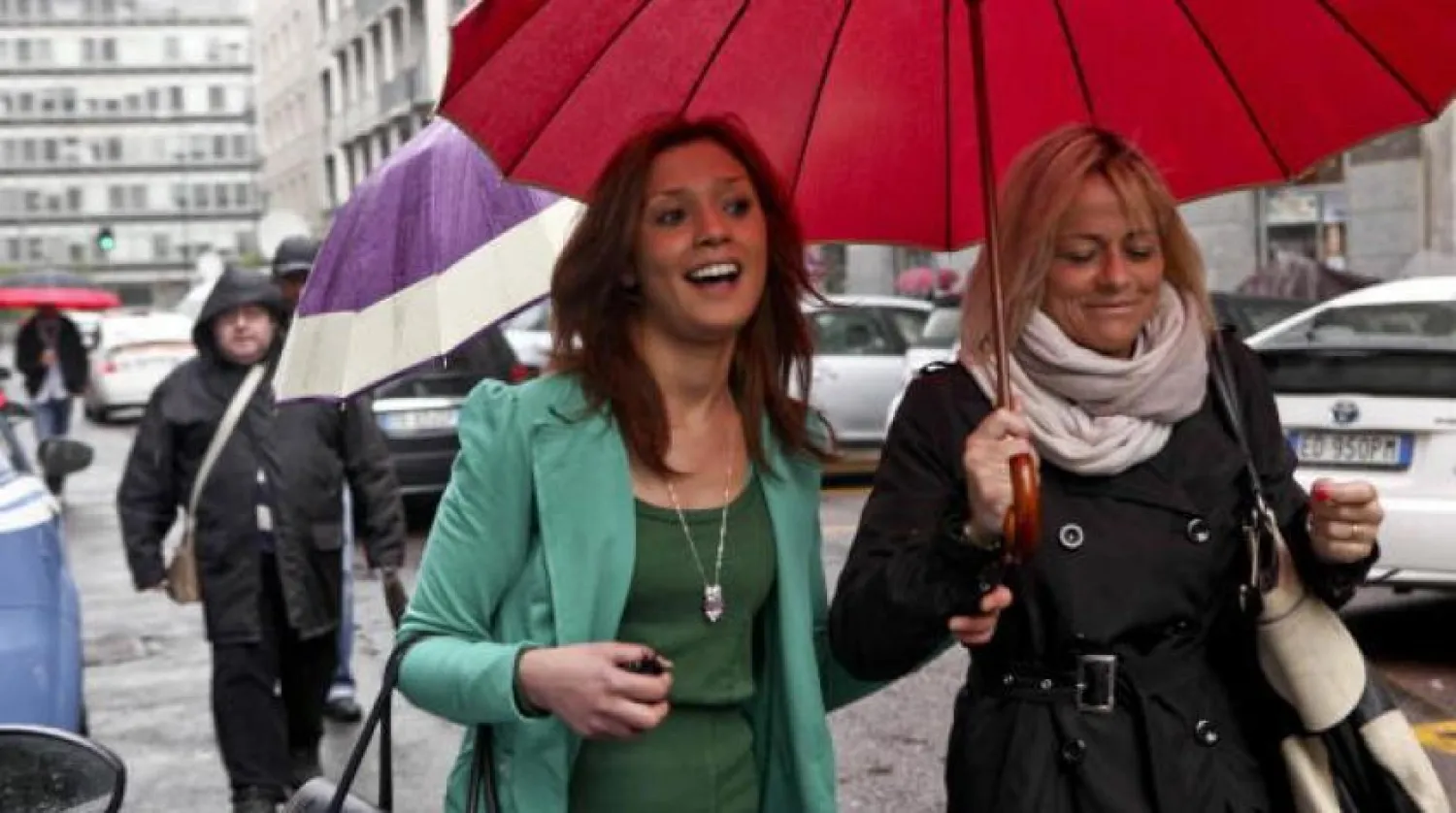 Maroccan model Imane Fadil (L) and an unidentified companion arrives at the Milan court, to be heard as witness, in Milan, Italy, 16 April 2012. EPA/DANIELE MASCOLO