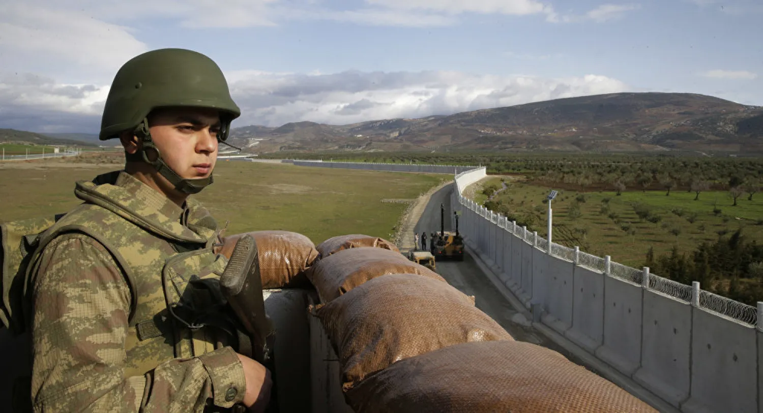 A Turkish soldier mans an outpost near the border with Syria. (AP)
