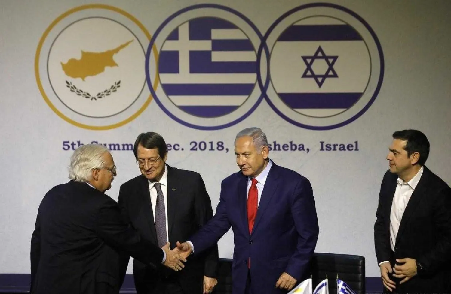 US Ambassador to Israel David Friedman (L) Israeli Prime Minister Benjamin Netanyahu, Cypriot President Nicos Anastasiades (2L) and Greek Prime Minister Alexis Tsipras (R), during the 5th Israel-Greece-Cyprus summit on December 20, 2018 (AFP)