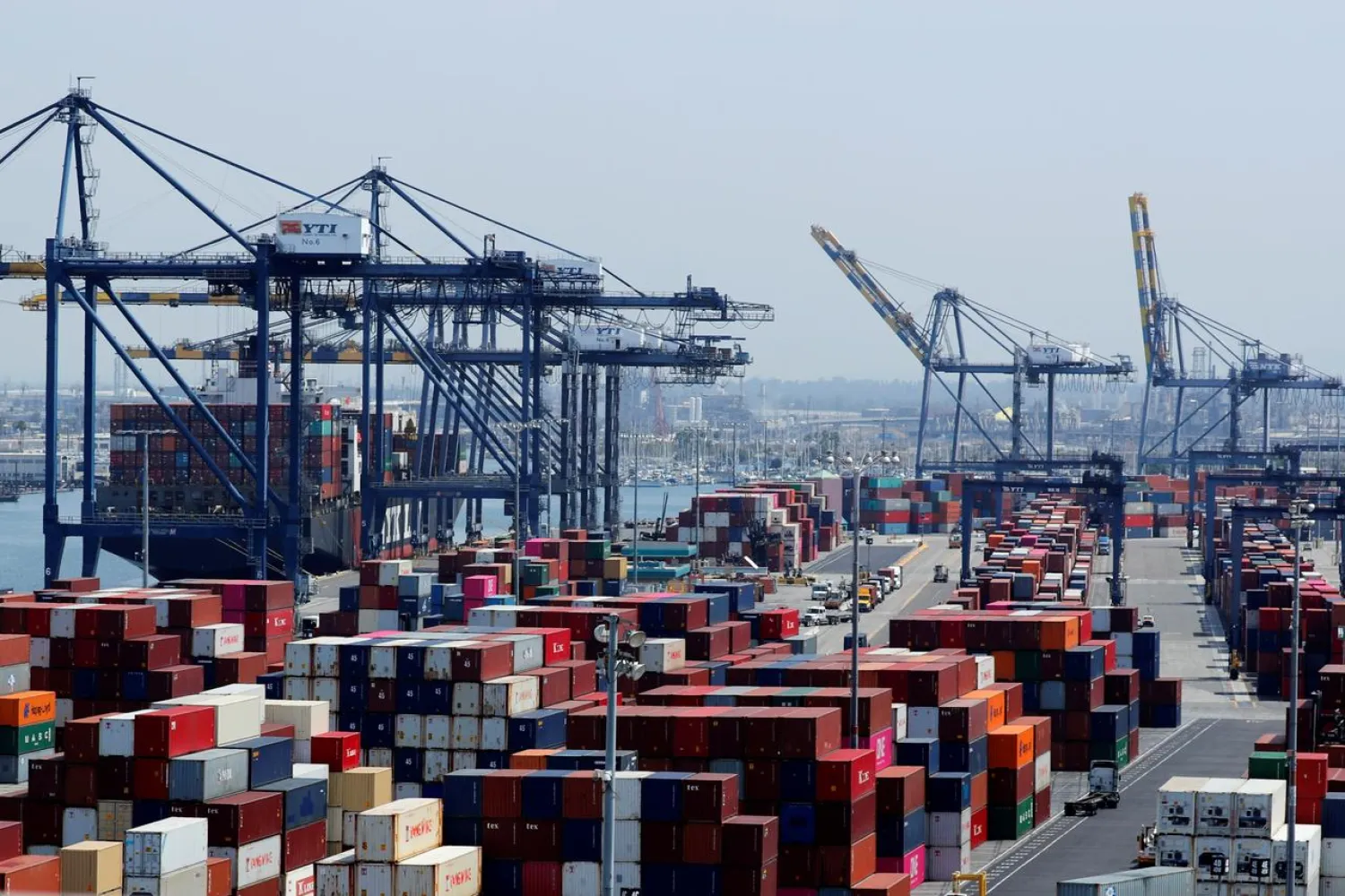 FILE PHOTO: Ship and containers are shown at the port of Los Angeles in Los Angeles, California, U.S. July 16, 2018. REUTERS/Mike Blake
