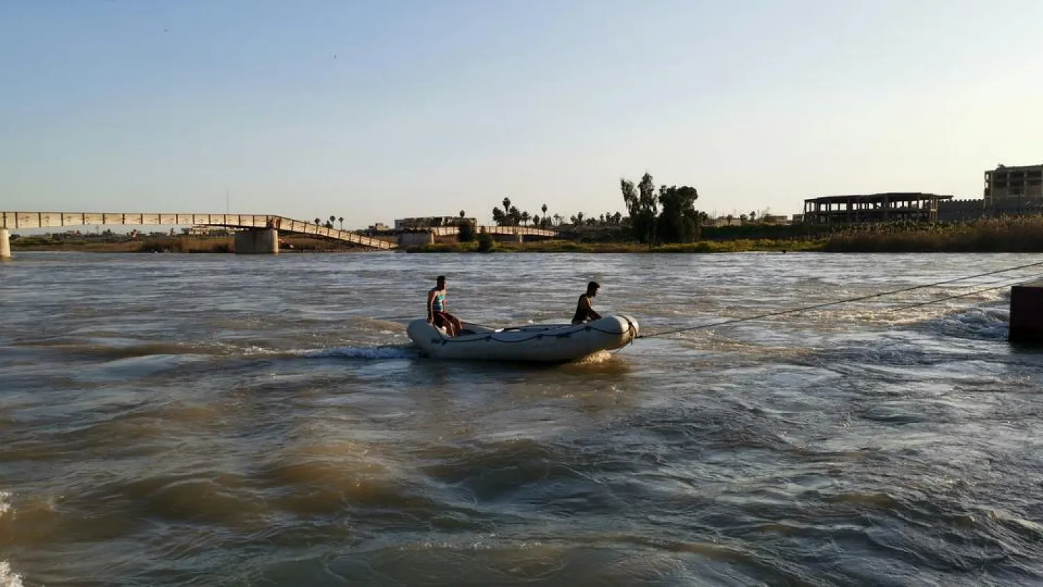 Iraqi rescuers search for survivors over the site where an overloaded ferry sank in the Tigris river near Mosul in Iraq, March, 21, 2019. (Reuters)