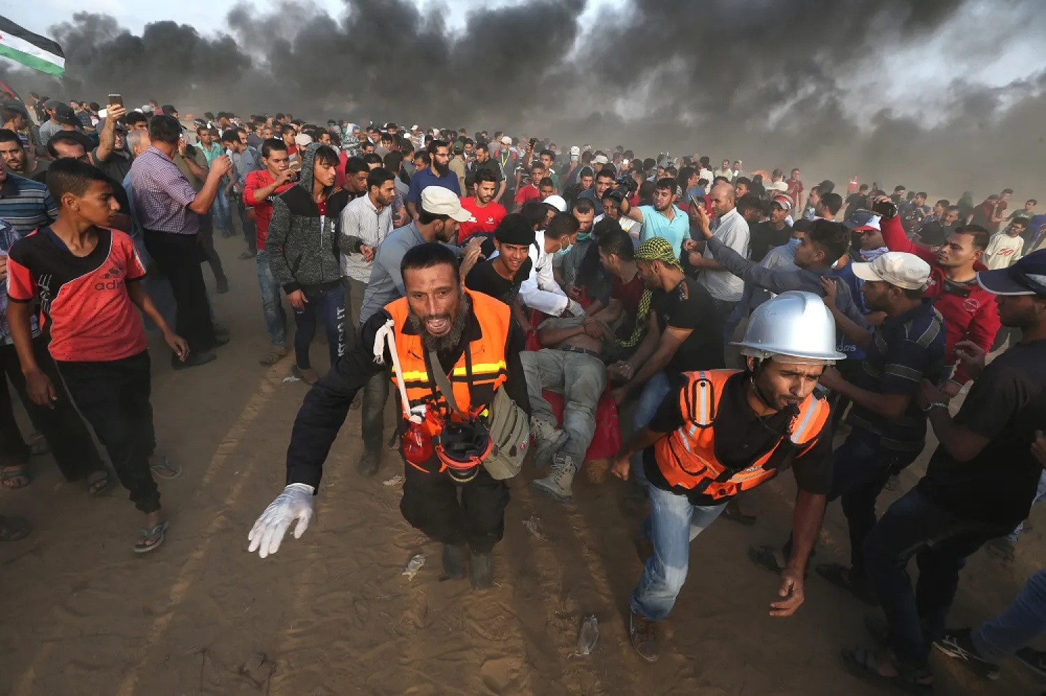 A wounded Palestinian is evacuated during a protest calling for lifting the Israeli blockade on Gaza, at the Israel-Gaza border fence in the southern Gaza Strip October 19, 2018. (Reuters)