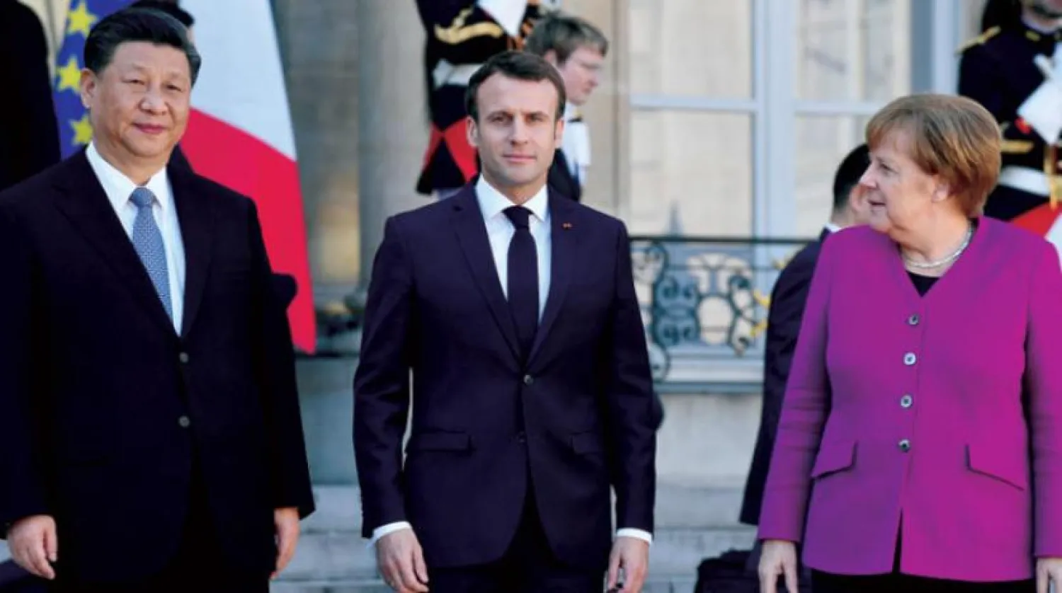 Şi, Macron ve Merkel dün Elysee Sarayı’nda yapılan görüşmenin ardından böyle poz verdiler (EPA)