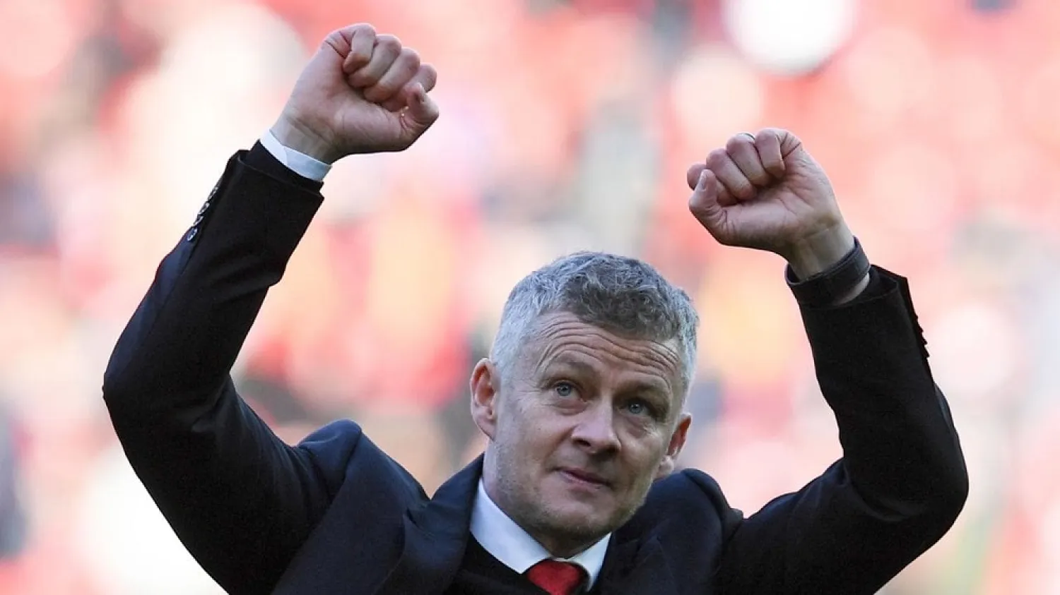Manchester United's manager Ole Gunnar Solskjaer applauds the fans after the win against Watford on Saturday. (AFP)