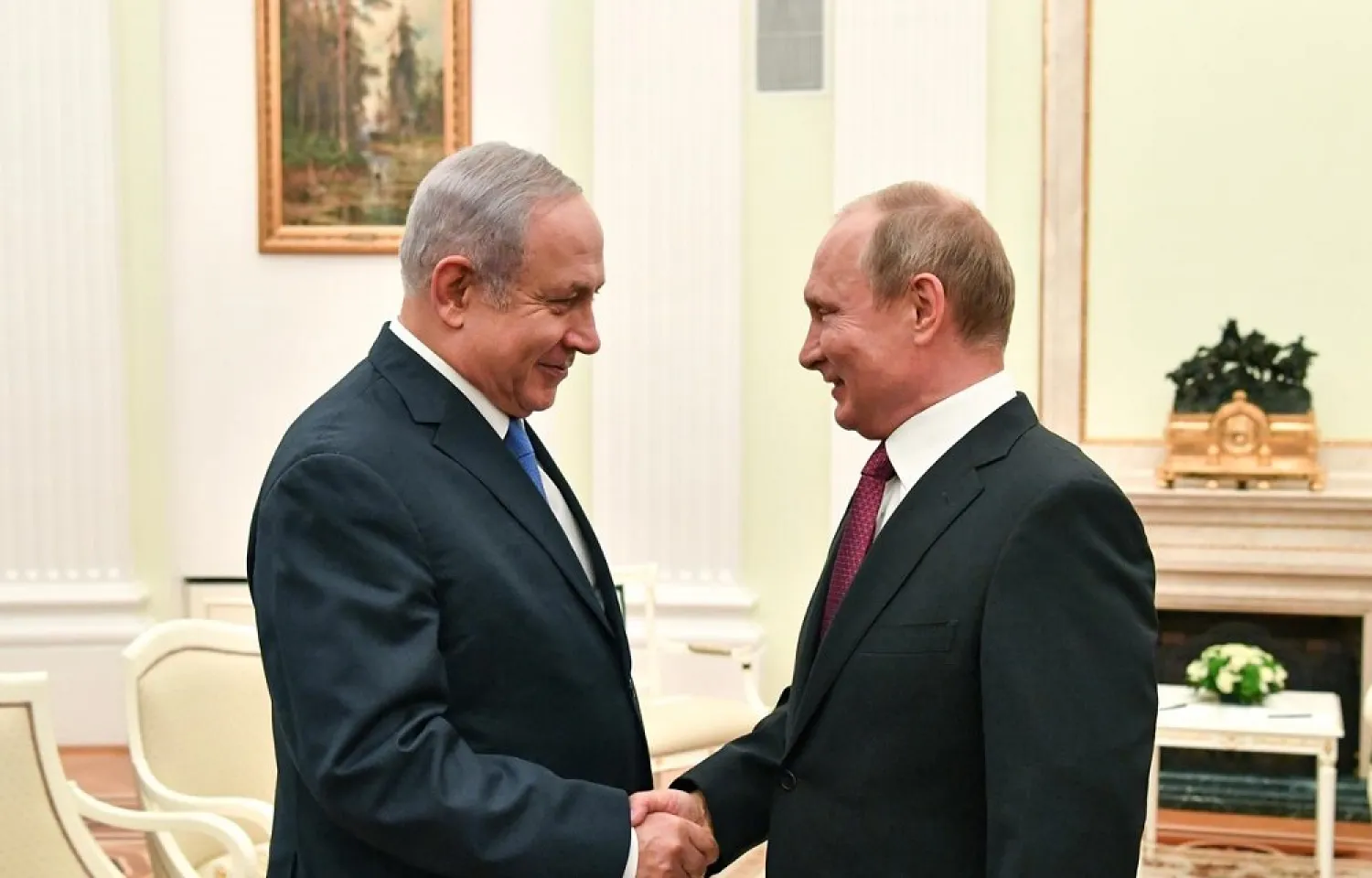 Russian President Vladimir Putin shakes hands with Israeli PM Benjamin Netanyahu during their meeting at the Kremlin in Moscow, Russia July 11, 2018. (Reuters)