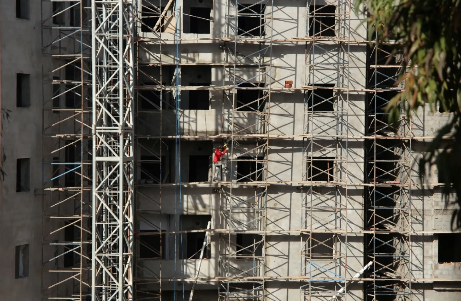 A builder works at the construction site of a new building in Tunis, Tunisia November 29, 2017. (Reuters)