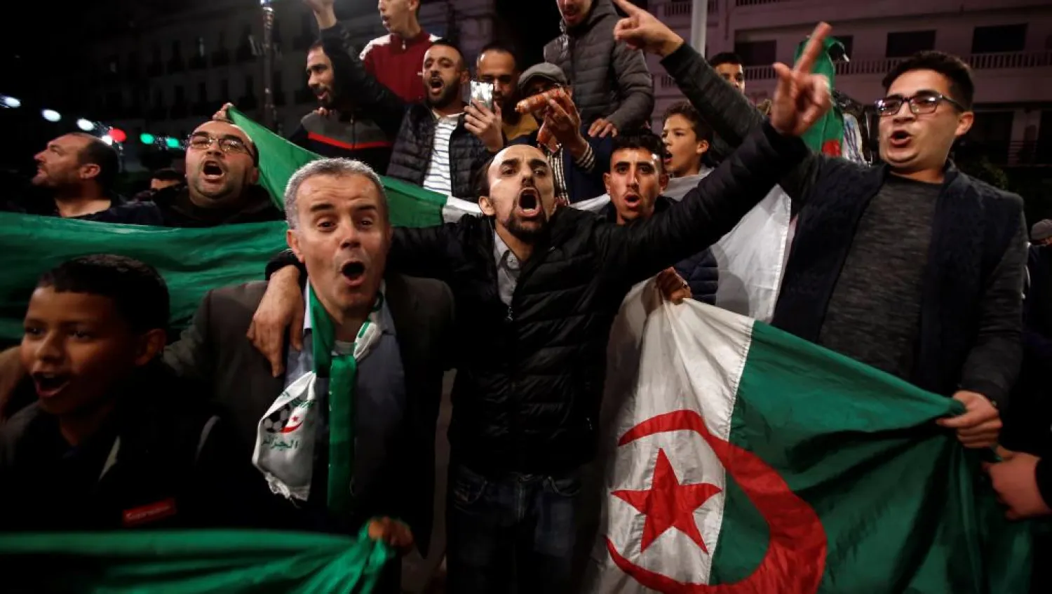 Algerians celebrate following Bouteflika's resignation. (Reuters)