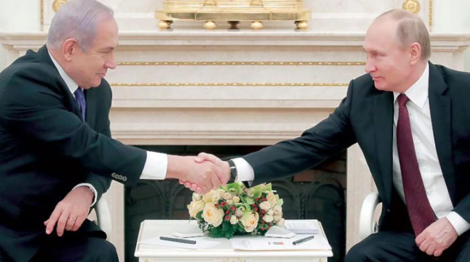 Russian President Vladimir Putin receives Israeli Prime Minister Benjamin Netanyahu in Moscow last February (EPA)