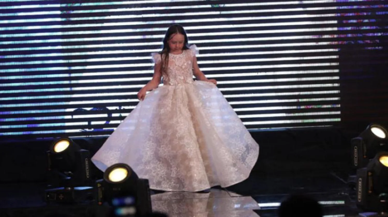 Syrian children with Down syndrome along with Syrian models walk down the catwalk during a fashion show held at the Sheraton hotel in Damascus, Syria, on 29 March 2019. EPA/YOUSSEF BADAWI