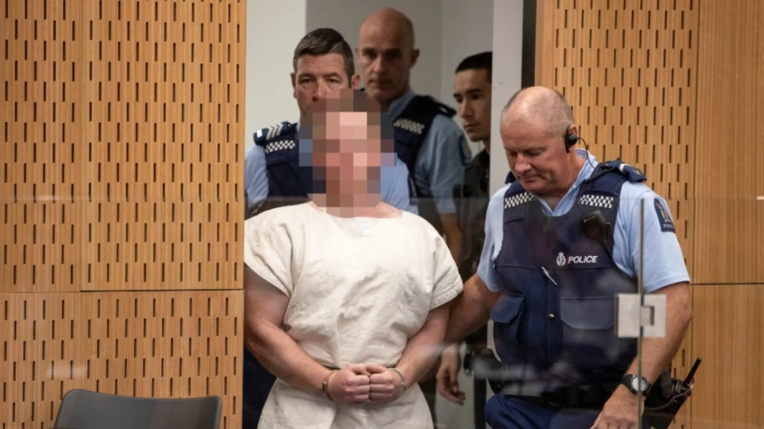 Brenton Tarrant is lead into the dock for his appearance in the Christchurch District Court, New Zealand Mar 16, 2019. Mark Mitchell/New Zealand Herald/Pool via REUTERS