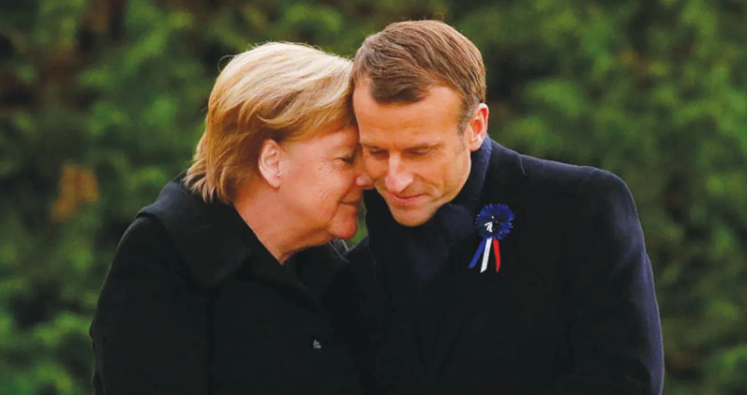 علاقة خاصة تجمع ميركل بماكرون(ا.ف.ب)