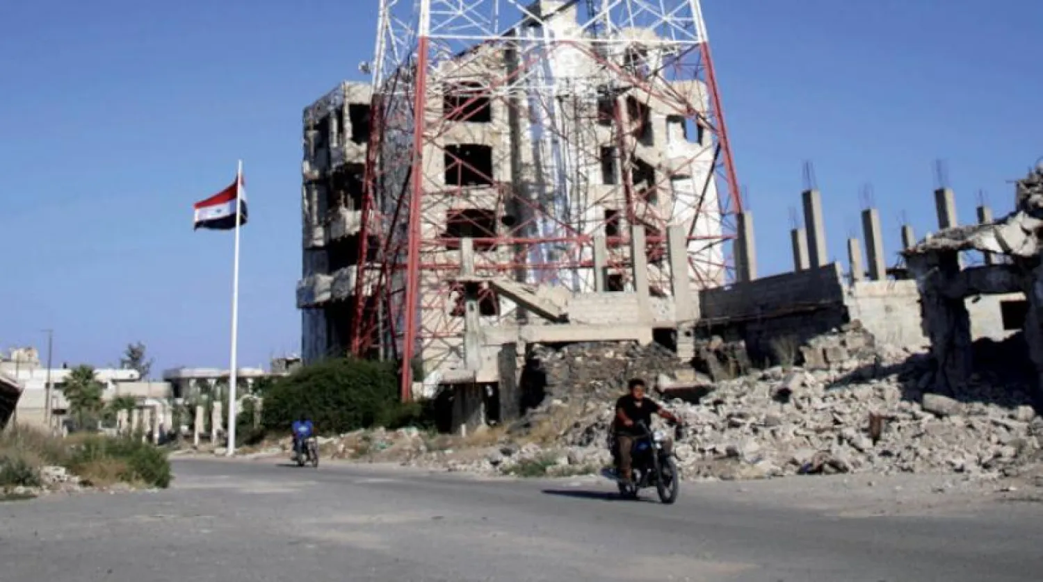Syrian official flag in Daraa, south of the country (Asharq Al-Awsat)

