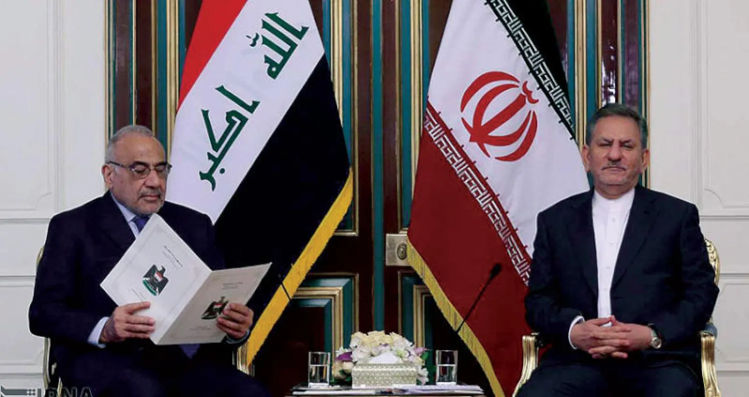 نائب الرئيس الإيراني ورئيس الوزراء العراقي على هامش مباحثات أمس (إرنا)